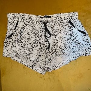 Size Medium black & white cute lil short shorts with pockets. Brand: REWASH